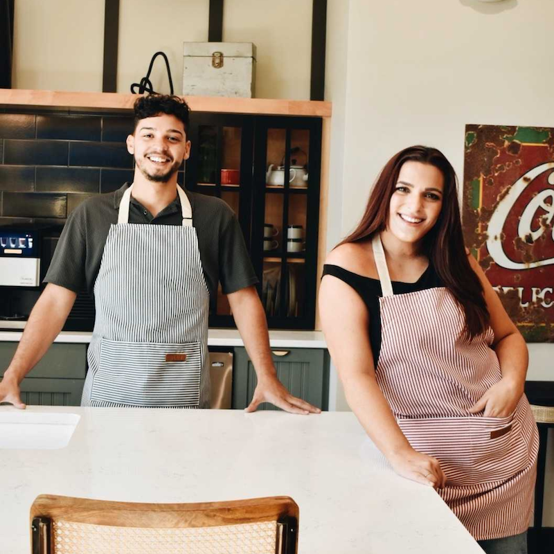 two people posing as the artists in residence program