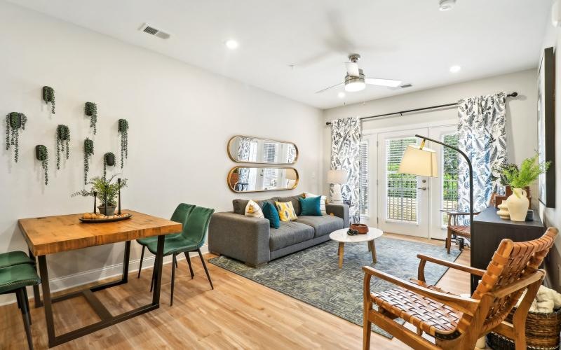 a living room with a couch and chairs