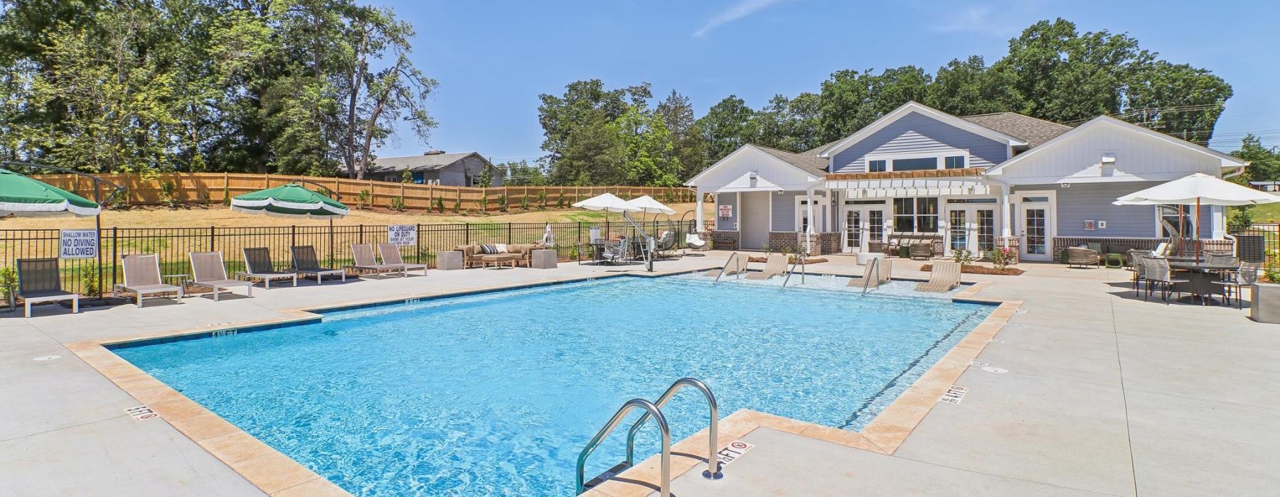 a swimming pool with a fence around it