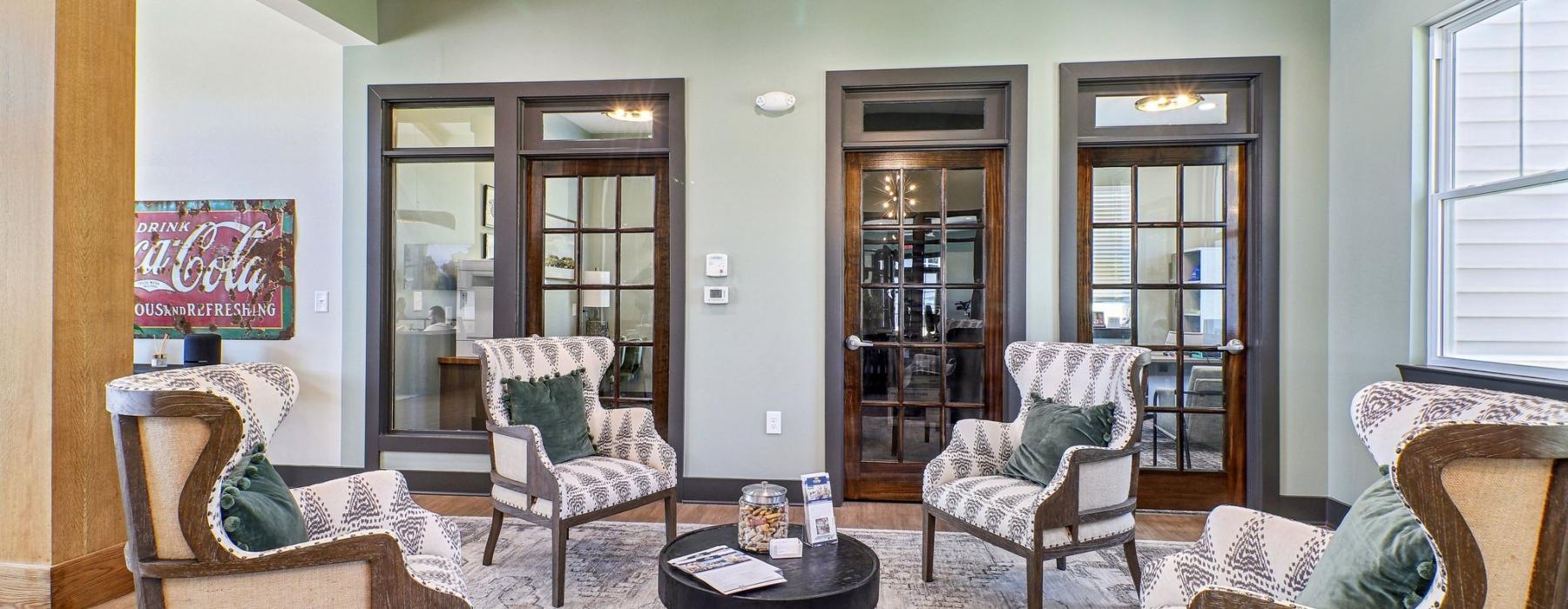 a living room with a couch and chairs