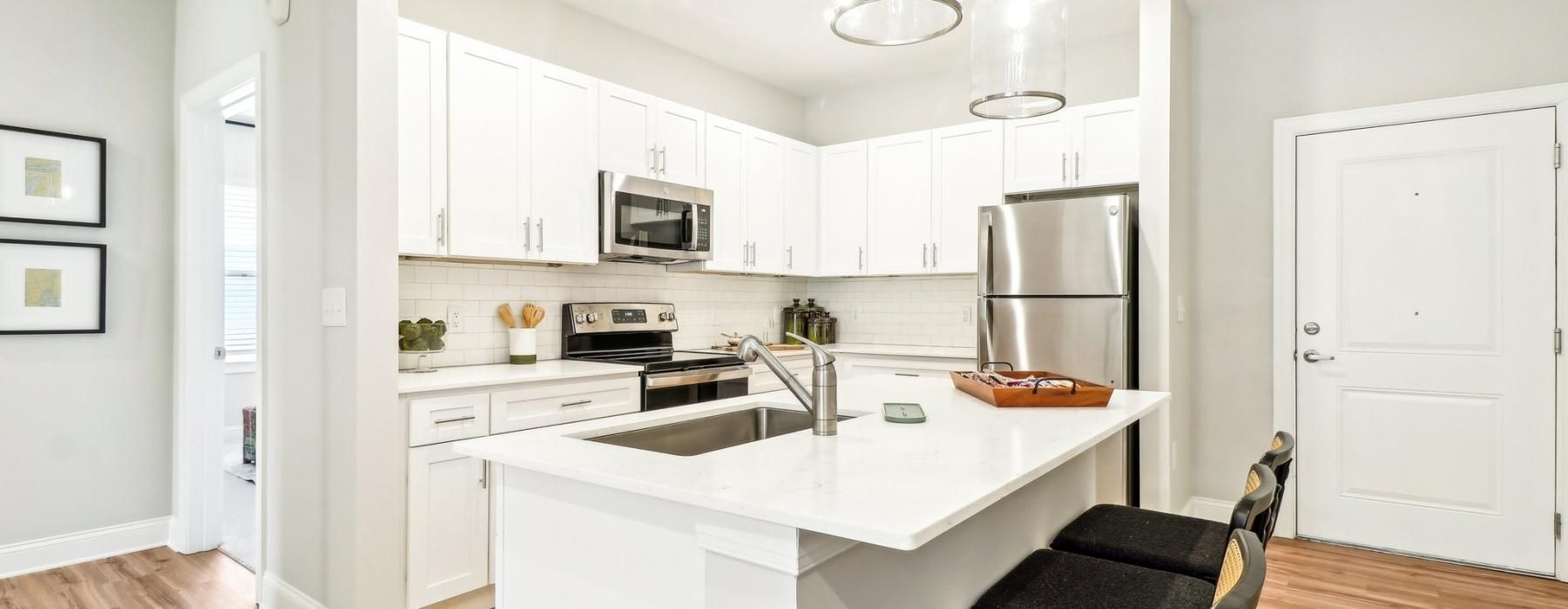 a kitchen with white cabinets