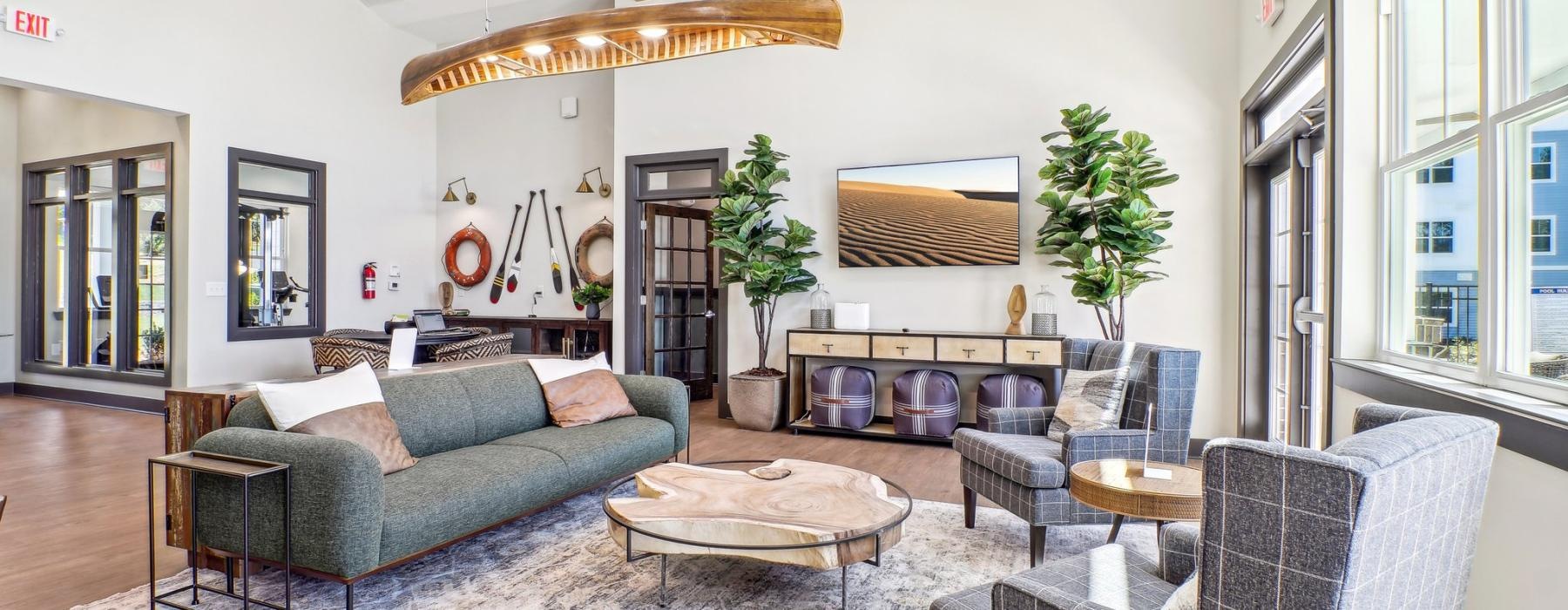 a living room with a couch and chairs