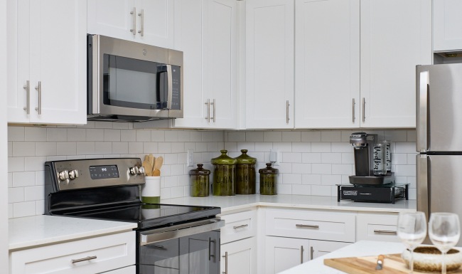 a kitchen with white cabinets