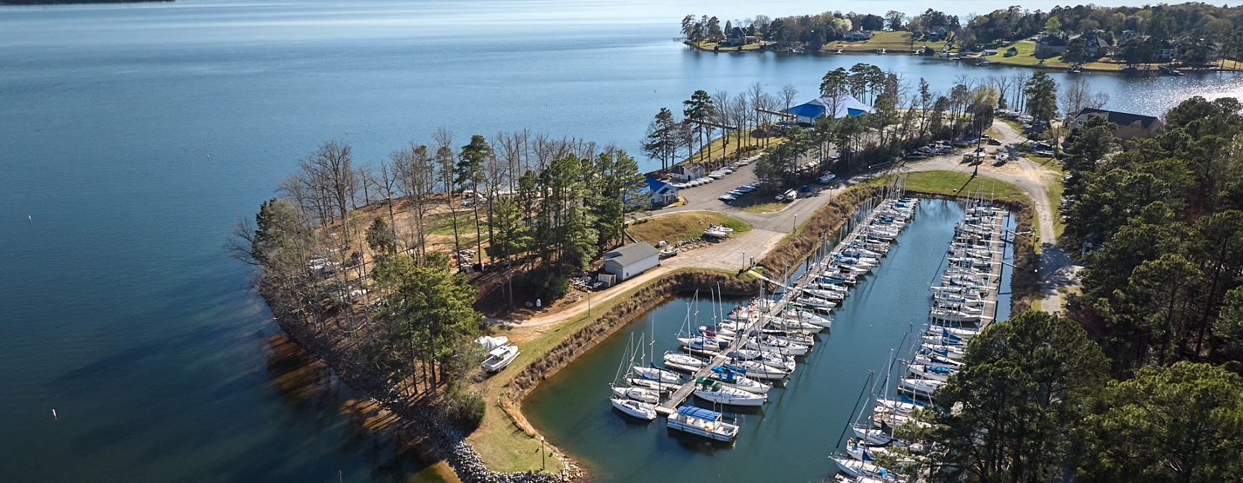 an aerial view of a lake with boats