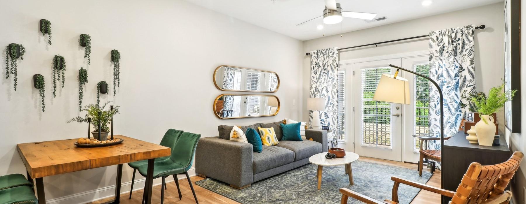 a living room with a couch and chairs